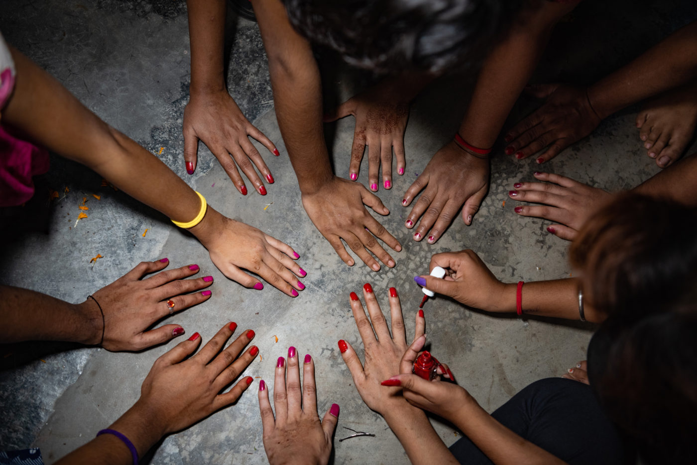 Girls paint their nails at a shelter in West Bengal, India